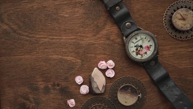 Vintage pocket watch on wooden background
