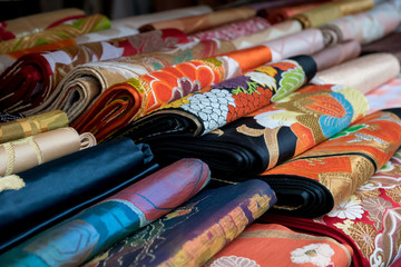 colorful japanese kimono belt obi for sale at market - obrazy, fototapety, plakaty
