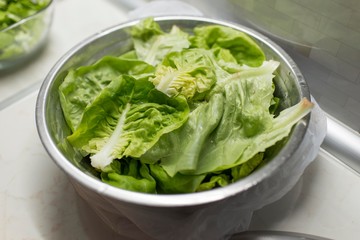 leafs of green salad in bowl