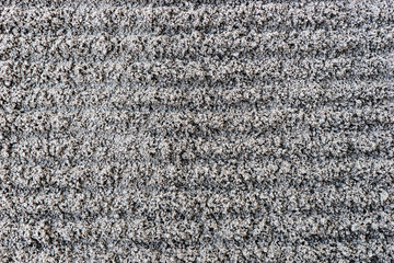 Dark gray fine gravel stones as background or texture