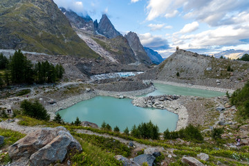 The Miage lake (Lac du Miage) and Miage glacier at the foot of the Mont Blanc massif, in Val Veny. Italian alps, Aosta Valley, Italy