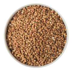 Buckwheat groats in a ceramic plate isolated on a white background. View from above