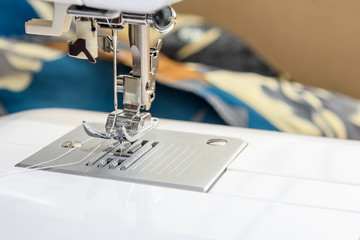 Close up part of a modern sewing machine