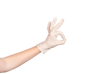 Hand in a white latex glove showing ok sign isolated on white background.