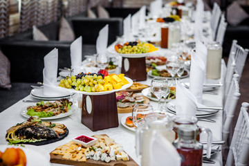 Table in a restaurant with fruit and food.
