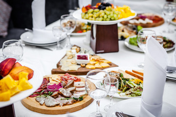Table in a restaurant with fruits and meat