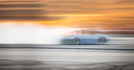 car drifting, Sport car wheel drifting and smoking on blurred background. Motorsport concept.