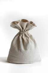 a bag of woven fabric, a linen bag on a white background, daylight, a bag for flour, grain, bulk products, money