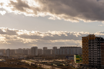 new residential quarter of the metropolis with a beautiful cloudy sky at dusk from a height