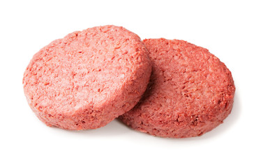 two pieces of ground meat substitutes for vegetarian burgers isolated on white background