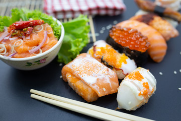 Sushi, Sashimi with chopsticks, Japanese sushi with soy sauce and wasabi.