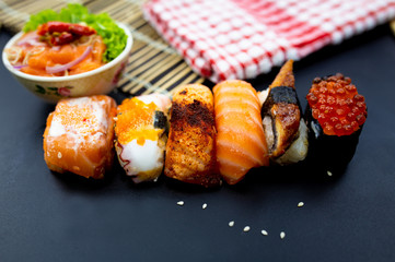Sushi, Sashimi with chopsticks, Japanese sushi with soy sauce and wasabi.