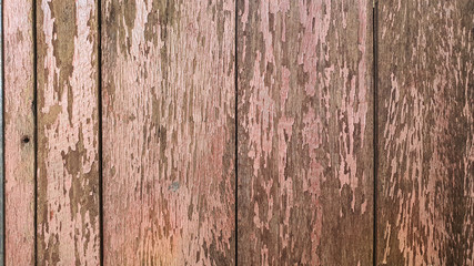 Old pink wood detail and texture for background. Rustic wooden 
Vertical pattern