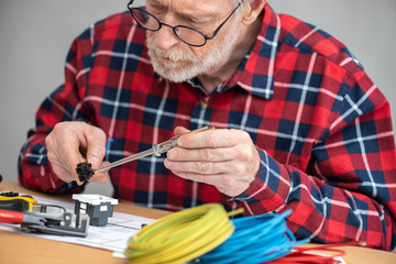 Electrician connecting wires in terminal block
