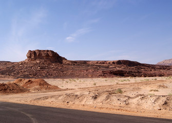 Beautiful panorama of the Sinai Desert. Mountains and sands of different shades. Clear blue sky