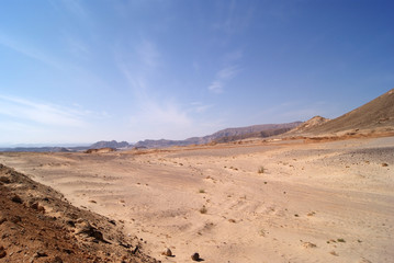 Beautiful panorama of the Sinai Desert. Mountains and sands of different shades. Clear blue sky