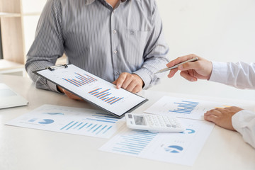 Two business leader discussing the charts and graphs showing the results, Planning to start new strategy for big success