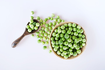 Top view turkey berry or Pea eggplant in the basket and wooden spoon isolated on white background.