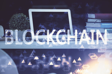 Multi exposure of blockchain and crypto economy theme hologram and table with computer background....