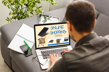 Businessman Using Laptop With Online Shopping Application On A Screen