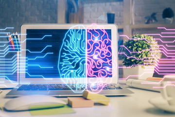 Double exposure of work space with computer and human brain drawing hologram. Brainstorm concept.