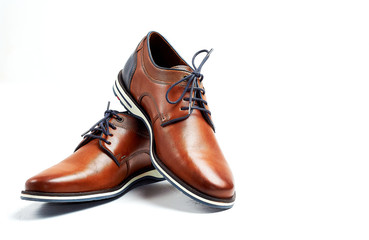 luxurious male brown and blue leather shoes isolated on a white