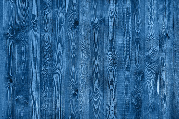 Fototapeta na wymiar old blue wooden fence with expressive wooden pattern