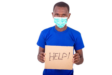 portrait of a young man with medical mask holding a poster