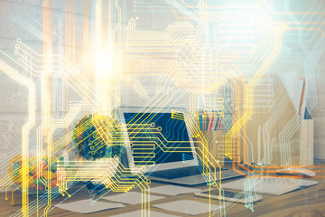 Double exposure of desktop with computer and world map hologram. International data network concept.