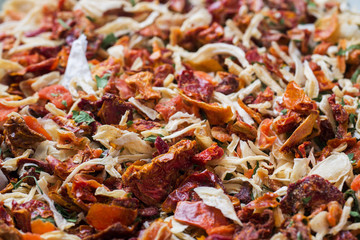 Dried spices, sun-dried tomatoes, dried carrots, Basil and Provencal herbs. Close-up Selective focus.