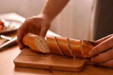 Pieces of bread on man's hands 