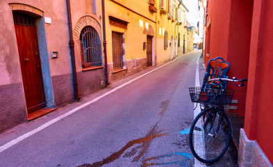 Perspective of street and bicycle near wall