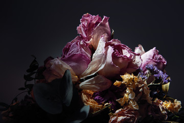 Close up of bouquet of dried flowers over dark background with copy space