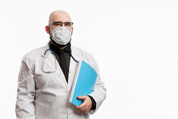 Bald male doctor in a white coat with a medical history in his hands. Quarantine during the coronavirus pandemic. Isolated on a white background. Space for text.