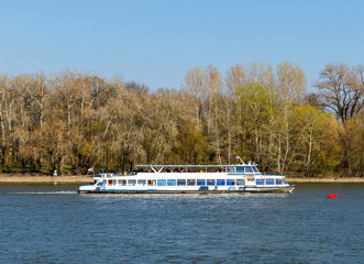 Tourist boat on Szentendre branch of Danube River on sunny day