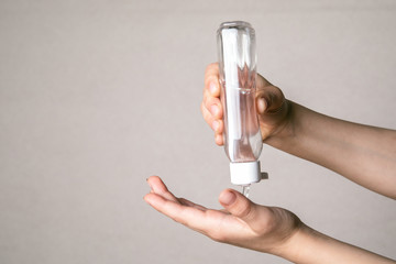 Child cleaning hands with antibacterial alcohol disinfectant