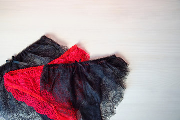 set of women's lace panties on a white background. Women's underwear on the table