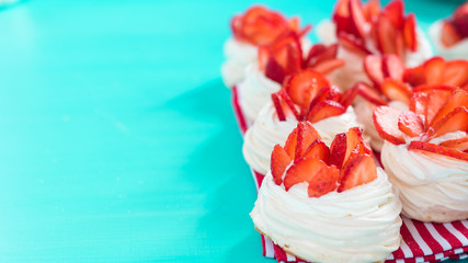 gourmet dessert pavlova strawberry on a blue background