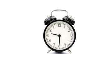 Vintage alarm clock on a white isolated background