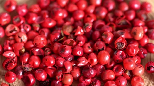 Food spices pink peppercorns red pepper Himalayan pepper berries. concept of fresh and dietary spices for cooking schools vegans and dietary products