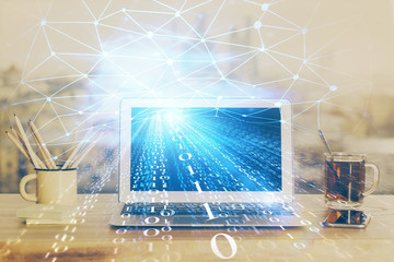 Double exposure of laptop computer and technology theme hologram. Concept of freelance work.