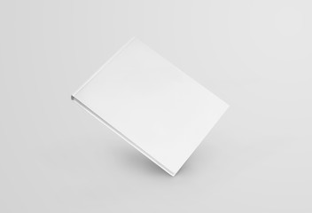 Mockup of a white book standing on a corner, front view, isolated on background.
