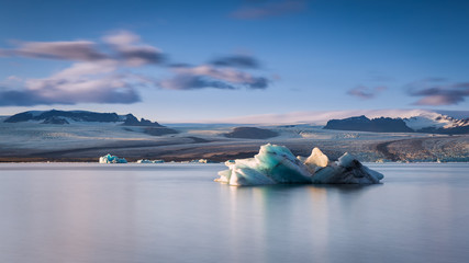 Jokulsarlon, glacier lagoon in Iceland with ice blocks floating in water.
