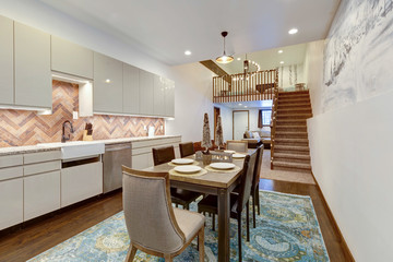 Luxury natural rustic and modern dining room interior design with tall ceiling and mural of old village