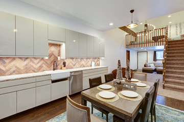 Luxury natural rustic and modern dining room interior design with tall ceiling and mural of old village