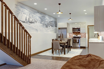 Luxury natural rustic and modern dining room interior design with tall ceiling and mural of old village