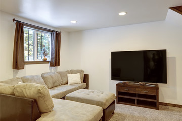 Living room interior with beige sofa, natural touches, custom build wooden bunk bed, tall ceiling with loft.