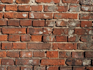 Fototapeta premium wall of old damaged red brick