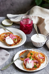 Breakfast made from traditional boxty fritters or latkes served with pickled onions and sour cream.