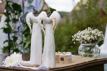 wedding angel decoration on the wooden table